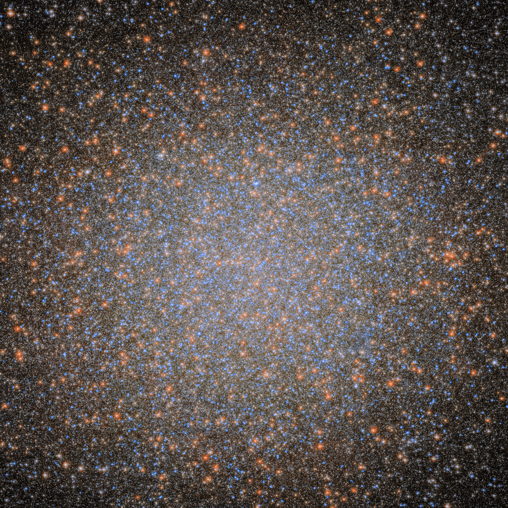 Gęste skupisko tysięcy gwiazd w centralnej części gromady kulistej Omega Centauri; widoczne są liczne niebieskie i pomarańczowe gwiazdy na ciemnym tle kosmosu.